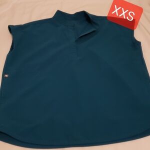 Used figs Rafaela  scrub Top, XSS Pacific blue.In good condition